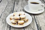 1725957376_2967459_stockphototraditionalserbianhomemadevanillacookieswithjamvanilicepntheplatewithcupofcoffein1676943703_ff.jpg